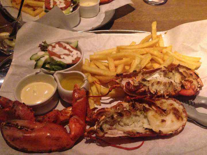 whole lobster grilled with chips and salad